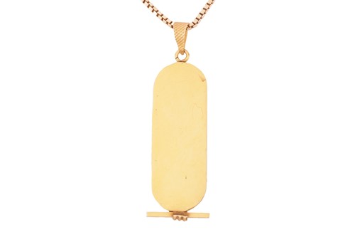Lot 158 - An Egyptian revival yellow metal pendant and...