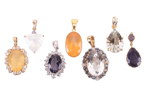 Lot 149 - A collection of seven gem-set pendants; to...