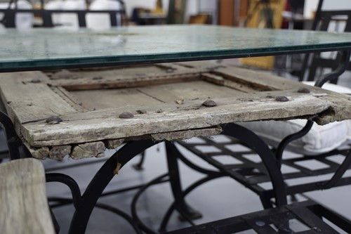 Lot 223 - A square blacksmith-made, black wrought iron...