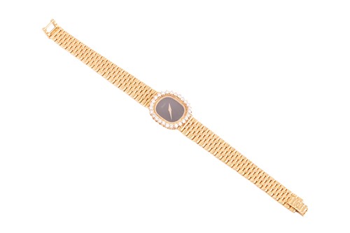 Lot 172 - A Piaget Diamond set dress watch in 18ct gold....