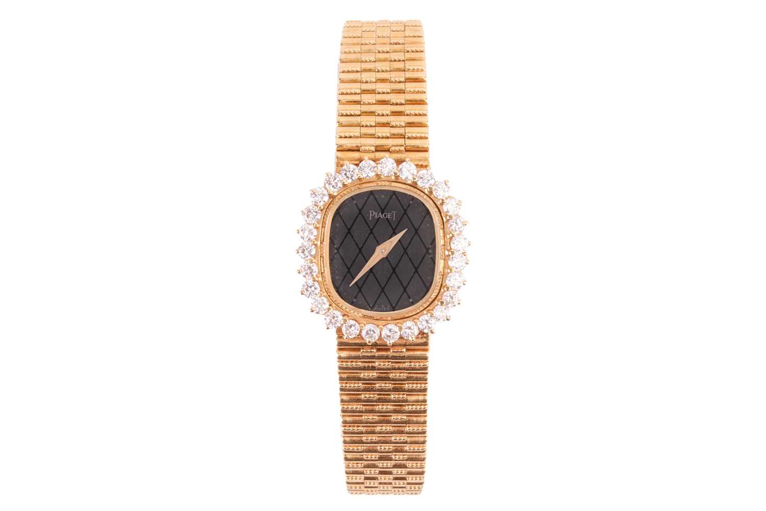 Lot 172 - A Piaget Diamond set dress watch in 18ct gold....