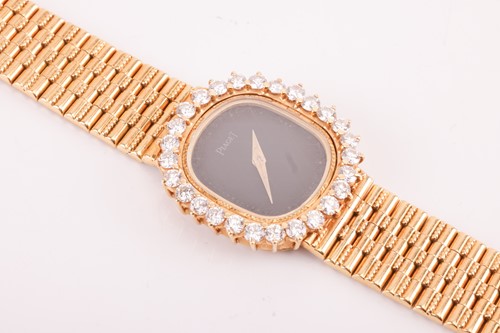 Lot 172 - A Piaget Diamond set dress watch in 18ct gold....