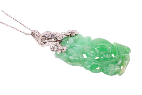 Lot 41 - An Art Deco carved jade pendant with...
