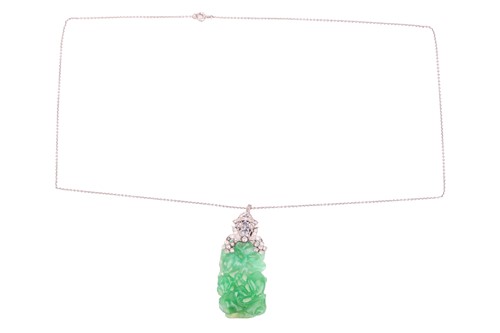 Lot 41 - An Art Deco carved jade pendant with...