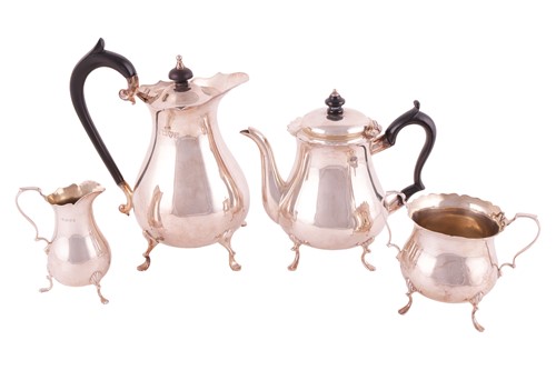 Lot 222 - A four piece tea set; circular low bellied...