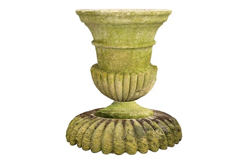 Lot 247 - A carved and established limestone campana urn...