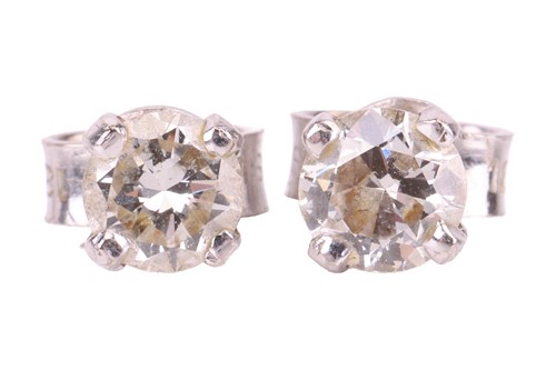 Lot A pair of diamond solitaire stud earrings,...