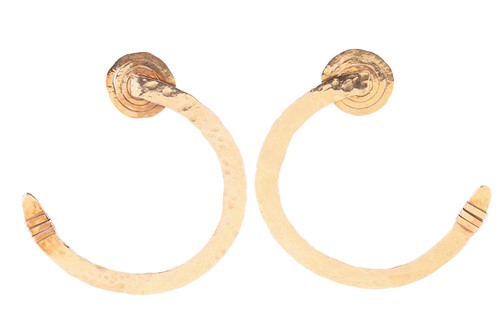 Lot A pair of abstract, hammered gold hoop...