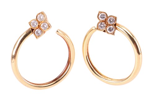 Lot 20 - Cartier - a pair of 'Hindu' diamond set hoop...