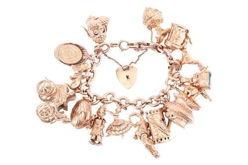 Lot A 9ct gold charm bracelet; the oval link...