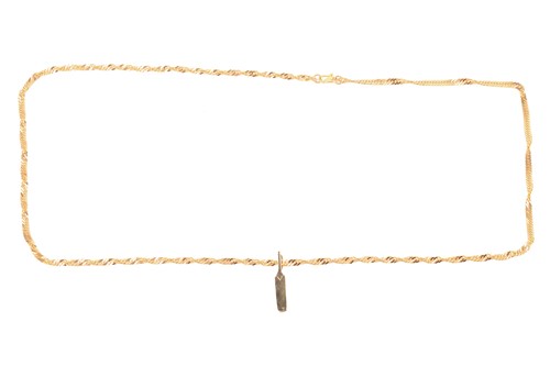 Lot 24 - A cricket bat pendant on chain, on a flat curb...