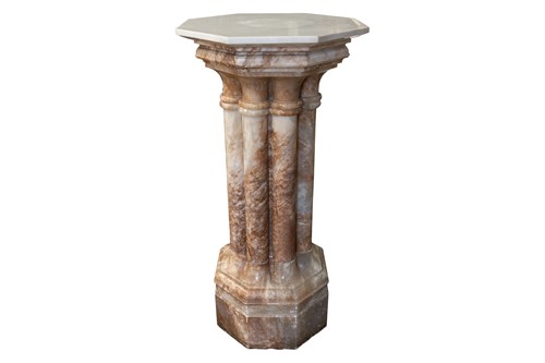 Lot 208 - A variegated pink marble column, with a white...