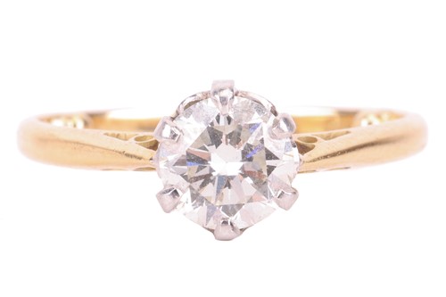 Lot A diamond solitaire ring, claw-set with a...