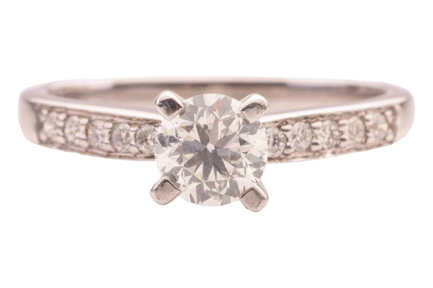 Lot 21 - A diamond ring in 18ct white gold, centred...