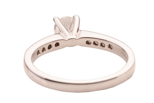 Lot 21 - A diamond ring in 18ct white gold, centred...