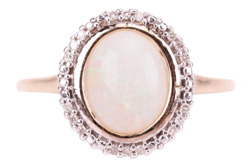 Lot An opal dress ring in 9ct yellow gold, centred...