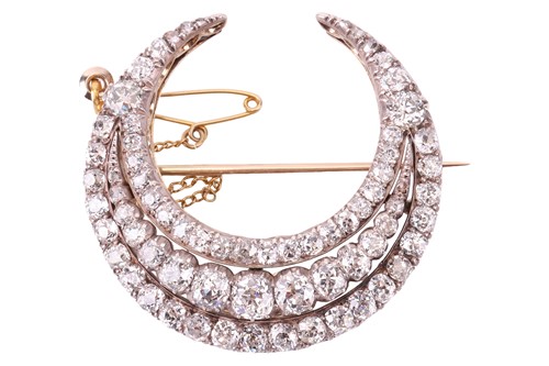 Lot 79 - A Victorian diamond crescent brooch, featuring...