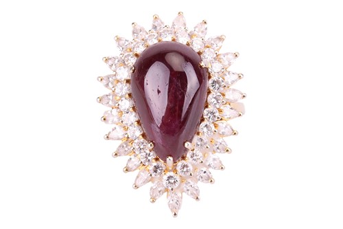 Lot 144 - A ruby and diamond cluster ring, centred with...