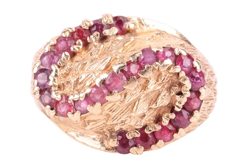 Lot 72 - A ruby-set bombé ring in 9ct yellow gold,...