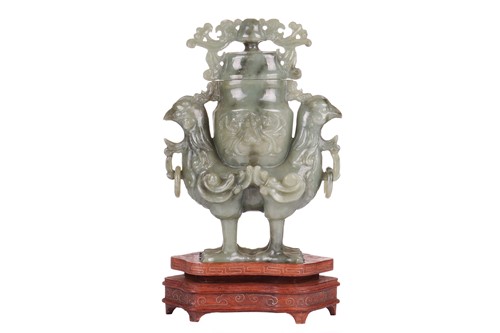 Lot 162 - A Chinese-carved grey, green jade peacock urn...