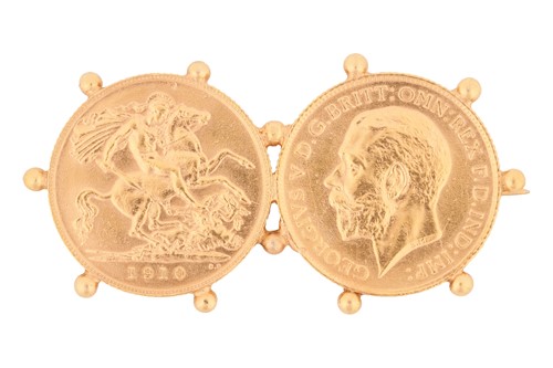 Lot A double half-sovereign brooch, comprising the...