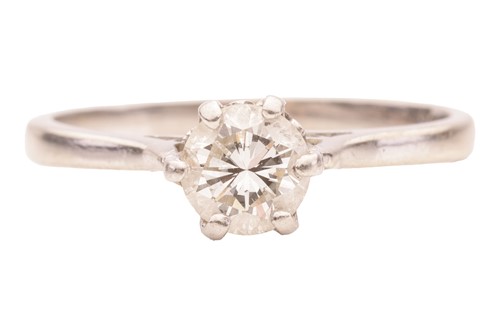 Lot A diamond solitaire ring, claw-set with a...