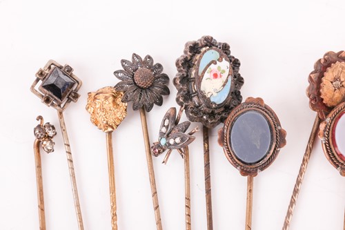 Lot 37 - A collection of stick pins; to include...