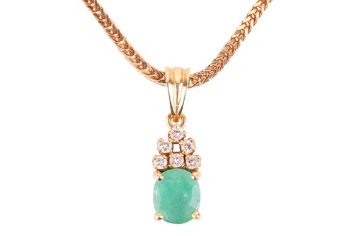 Lot 47 - An emerald and diamond-set pendant, the...