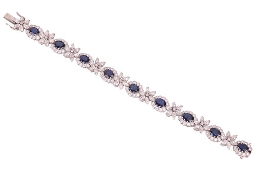 Lot 40 - A sapphire and diamond cluster line bracelet,...