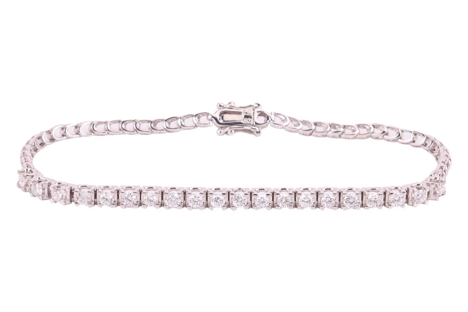 Lot 12 - A diamond-set line bracelet, set with twenty