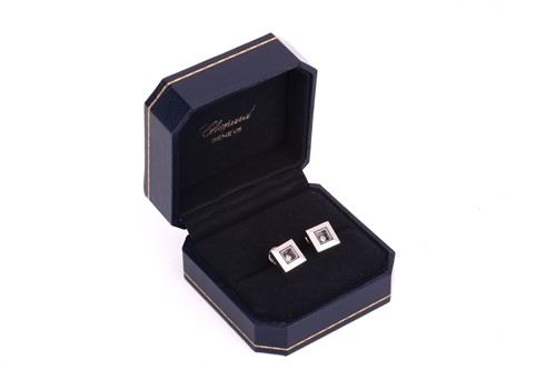 Lot 21 - Chopard - a pair of 'Happy Diamond' stud...