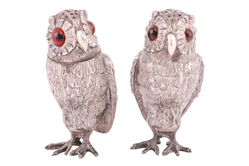 Lot 231 - A pair of French owl pepperettes, sculpted as...