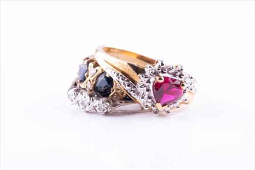 Lot 427 - A 9ct yellow gold, diamond, and sapphire ring...