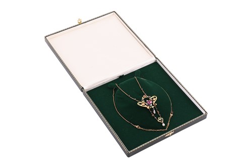 Lot 99 - An Art Nouveau gem-set floral lavaliere...