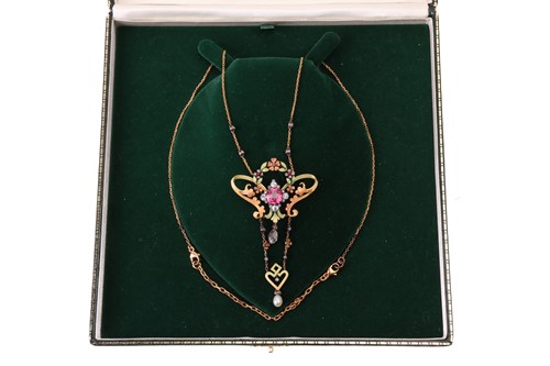 Lot 99 - An Art Nouveau gem-set floral lavaliere...