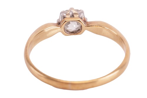 Lot 107 - A diamond solitaire ring, claw-set with an old-...