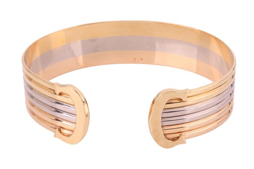 Lot 81 - Cartier - a double C 'de Cartier' cuff bangle...