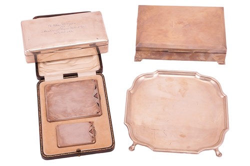 Lot 150 - A silver waiter, shaped square with raised...