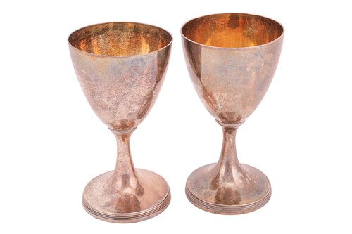 Lot 287 - A pair of George III silver goblets; plain...