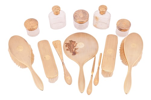 Lot 149 - A silver gilt engine-turned dressing table set,...