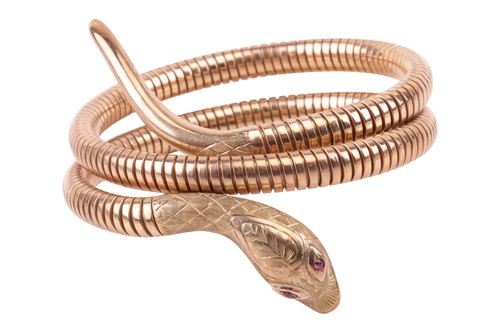 Lot 90 - A ruby-set serpent bracelet in 9ct yellow gold,...