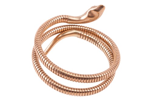 Lot 90 - A ruby-set serpent bracelet in 9ct yellow gold,...