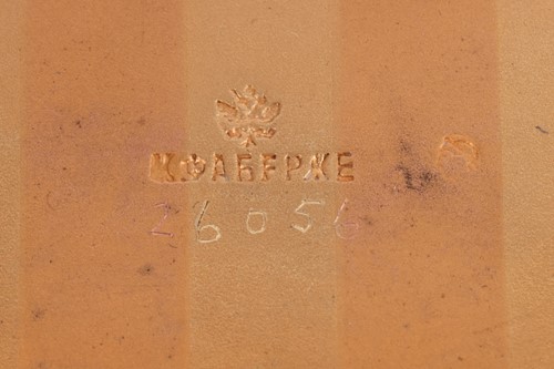 Lot 190 - A cigarette case by Fabergé, reeded case of bi-...