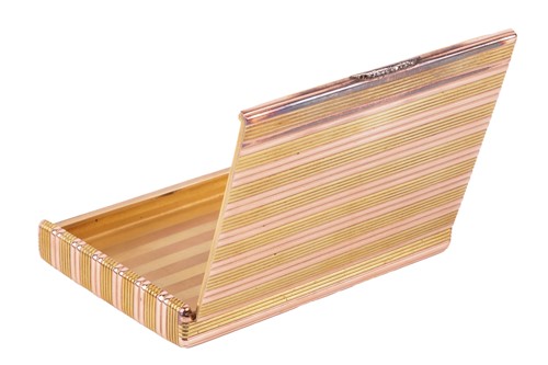 Lot 190 - A cigarette case by Fabergé, reeded case of bi-...