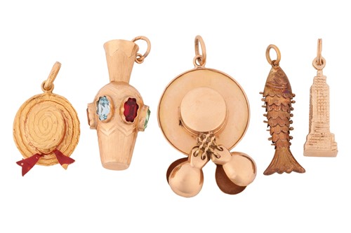 Lot 141 - A collection of five charms; including two...