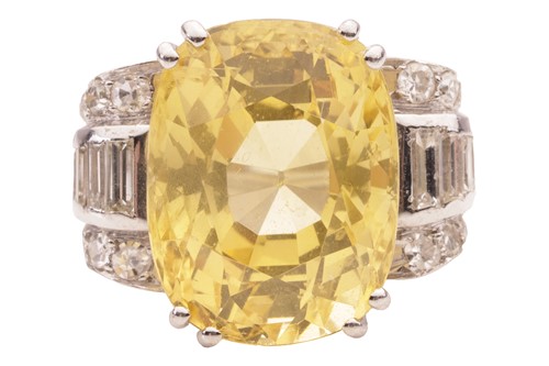 Lot 170 - A yellow sapphire and diamond dress ring, the...