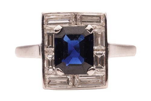 Lot 127 - A sapphire and diamond ring, the four-claw set...