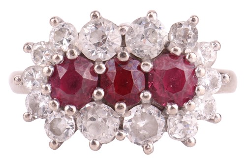 Lot 72 - A ruby and diamond dress ring, claw-set to the...