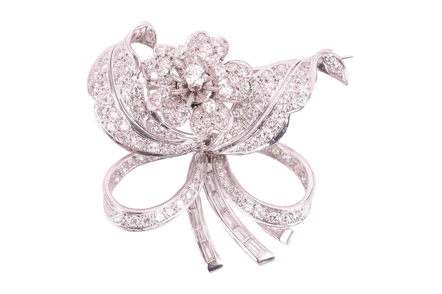 Lot 16 - A flower brooch set with diamonds, sculpted as...