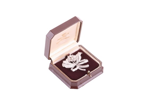 Lot 16 - A flower brooch set with diamonds, sculpted as...